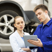 Mechanic and customer reviewing the repair costs